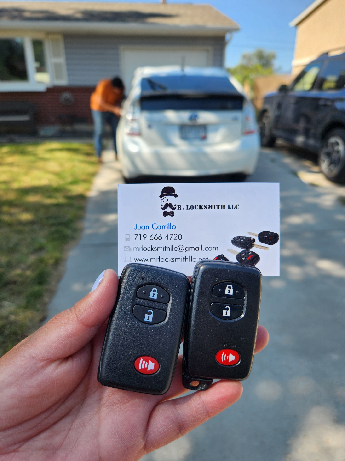 Two new Toyota Prius smart keys cut and programmed on-site with Mr. Locksmith business card